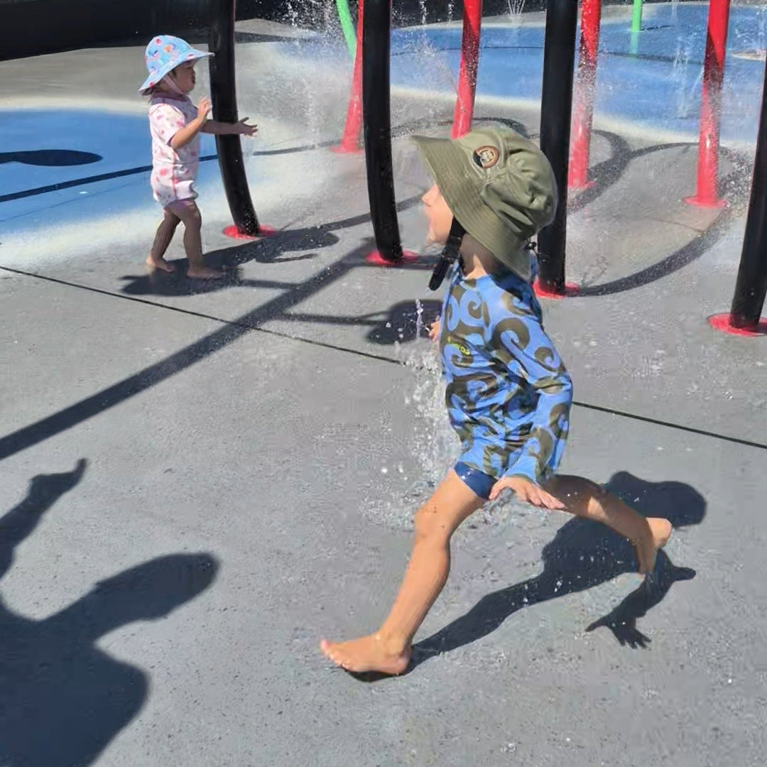 Children on water park wearing lightweight surf hat 